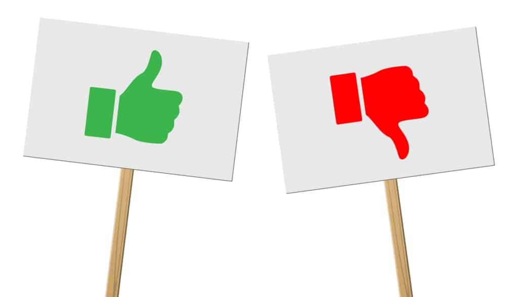 This image shows thumbs up and thumbs down signs to illustrate the comparison of Airtable vs. FileMaker
